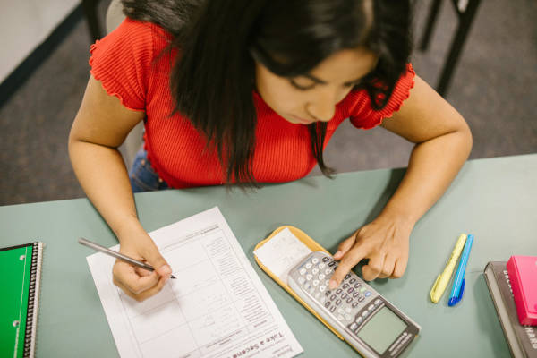 Lady working out finances on calclulator