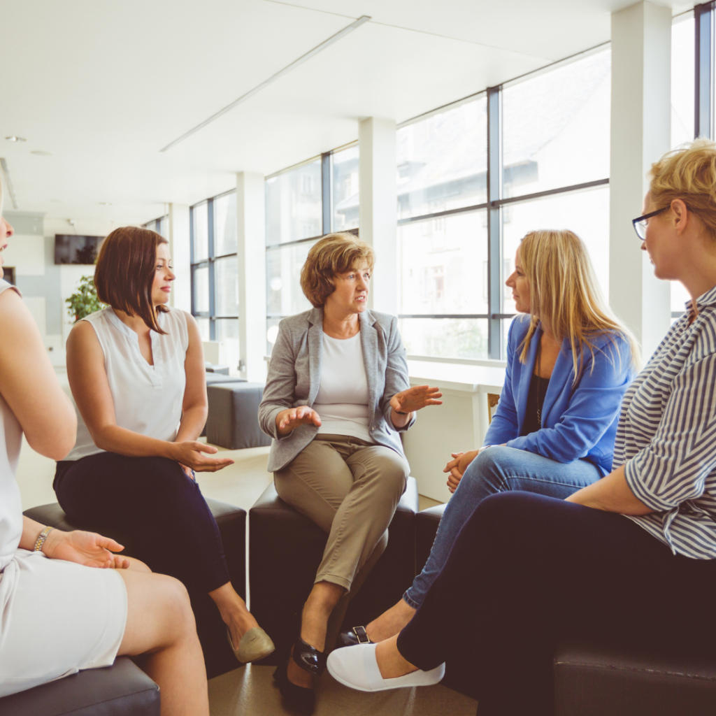 An image of nursery staff meeting for some risk assessment training.