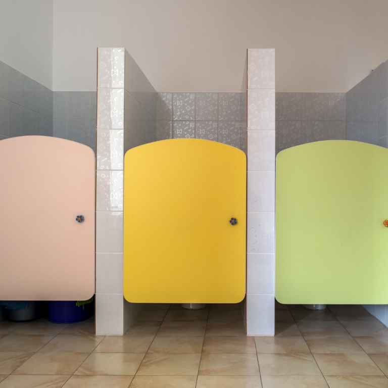 an image of 3 closed preschool toilet doors