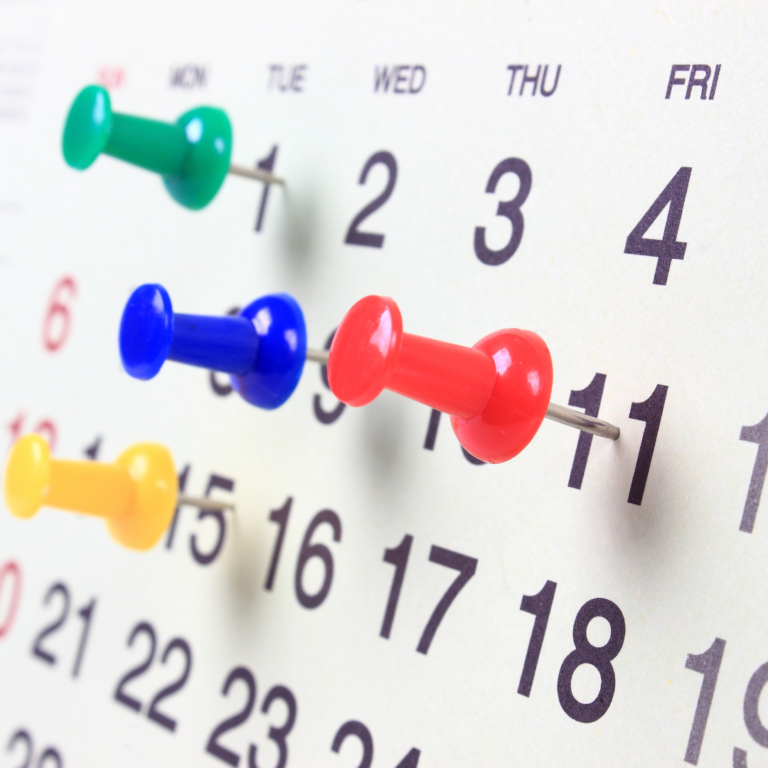 An image of a month on a calendar with coloured pins to denote events to remember